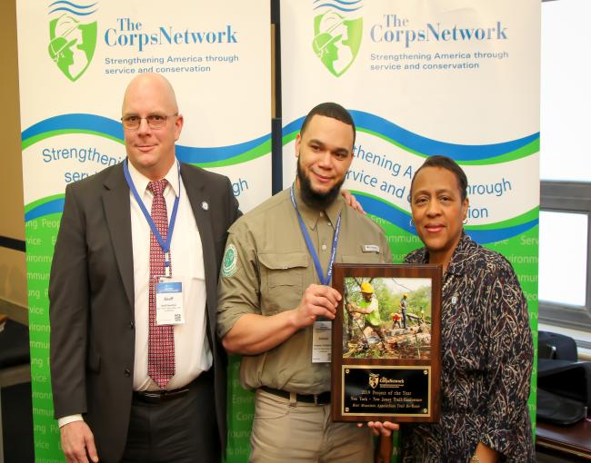 2019 Corps Network Project of the Year. Geoff Hamilton, Eduardo Gil, and Marie Walker, Chief Operating Officer of The Corps Network.